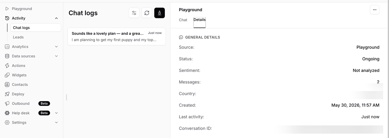 Chatbase Chat logs page showing left rail Playground Activity Chat logs Leads selected Analytics Data sources Actions Widgets Contacts Deploy Outbound Beta Help desk Beta Settings, center pane Chat logs list with single entry Sounds like a lovely plan and a great Just now I am planning to get my first puppy and my top, right pane Playground tab and Details tab selected showing General Details Source Playground Status Ongoing Sentiment Not analyzed Messages 2 Country blurred Created May 30 2026 11:57 AM Last activity Just now Conversation ID blurred
